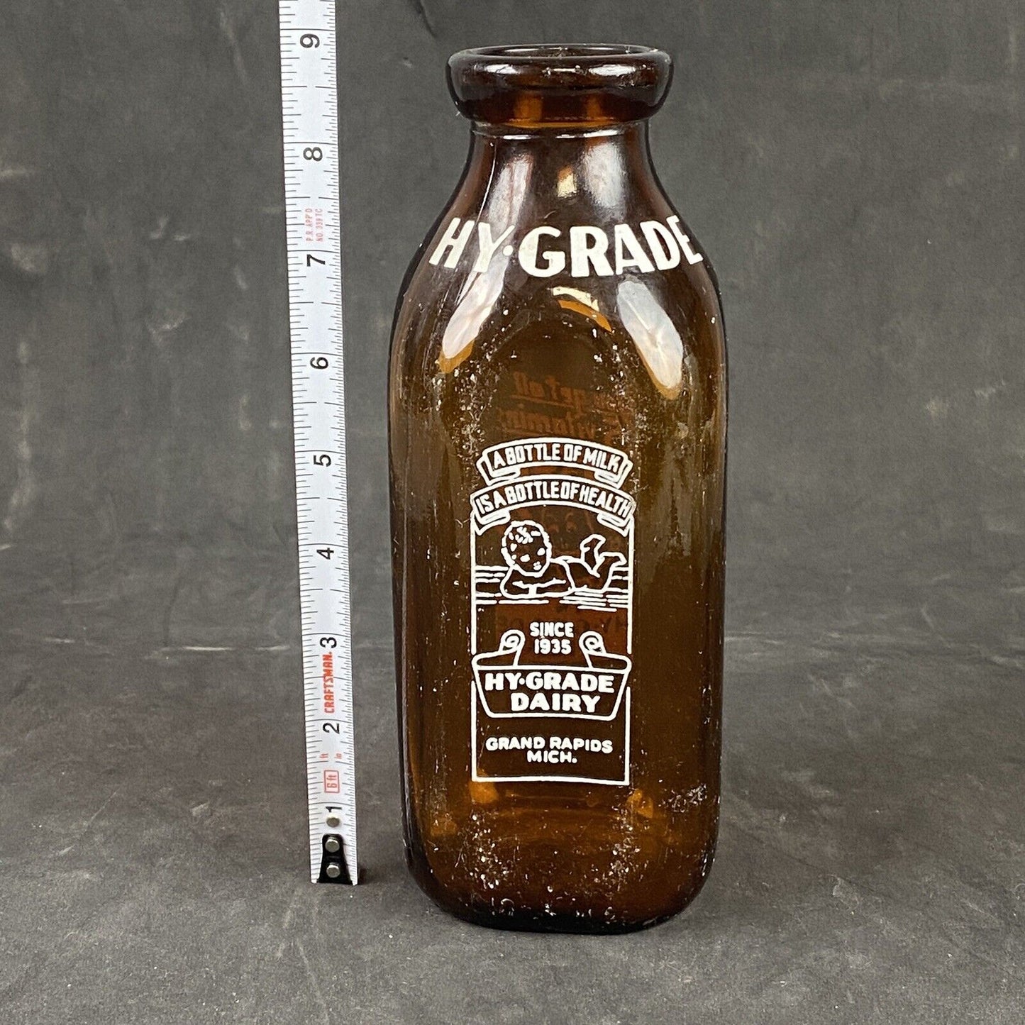 Hy-Grade Dairy Milk Bottle Grand Rapids MI Amber Glass w White Pyroglaze 8.5"