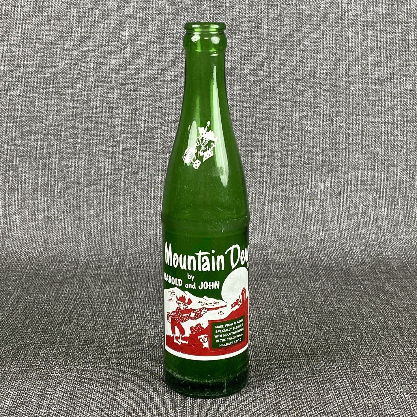 Vintage Mountain Dew 10 oz. Bottle by Harold and John Bottle- Has Flea Bite