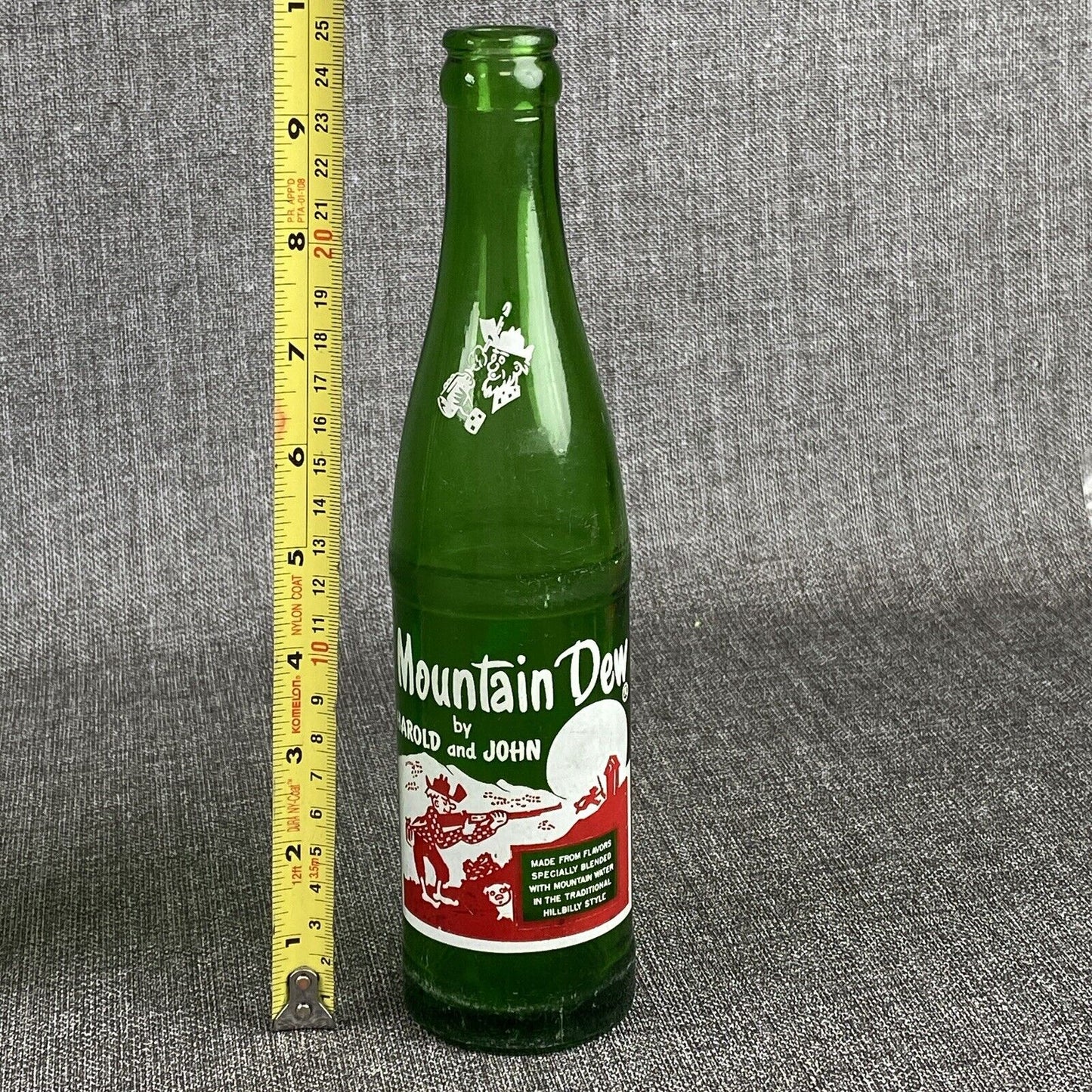 Vintage Mountain Dew 10 oz. Bottle by Harold and John Bottle- Has Flea Bite