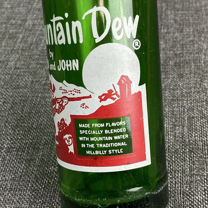 Vintage Mountain Dew 10 oz. Bottle by Harold and John Bottle- Has Flea Bite