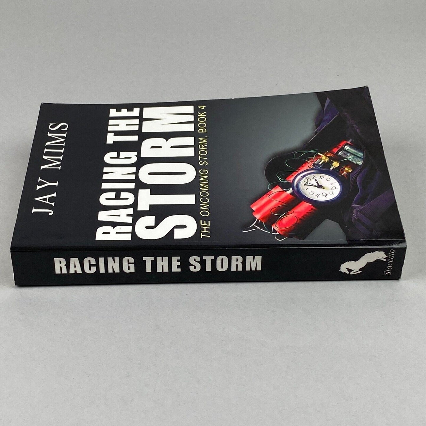 Racing The Storm - The Oncoming Storm Book 4 by Jay Mims Autographed Copy