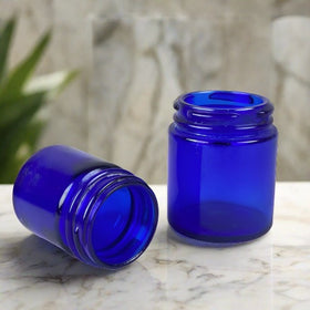 2 Cobalt Blue Glass Medicine Bottles (Vicks / Mezon)