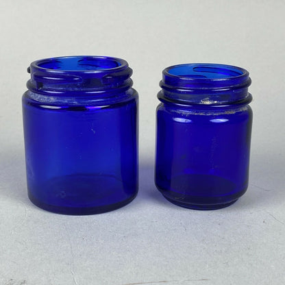 2 Cobalt Blue Glass Medicine Bottles (Vicks / Mezon)