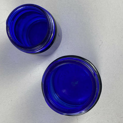 2 Cobalt Blue Glass Medicine Bottles (Vicks / Mezon)