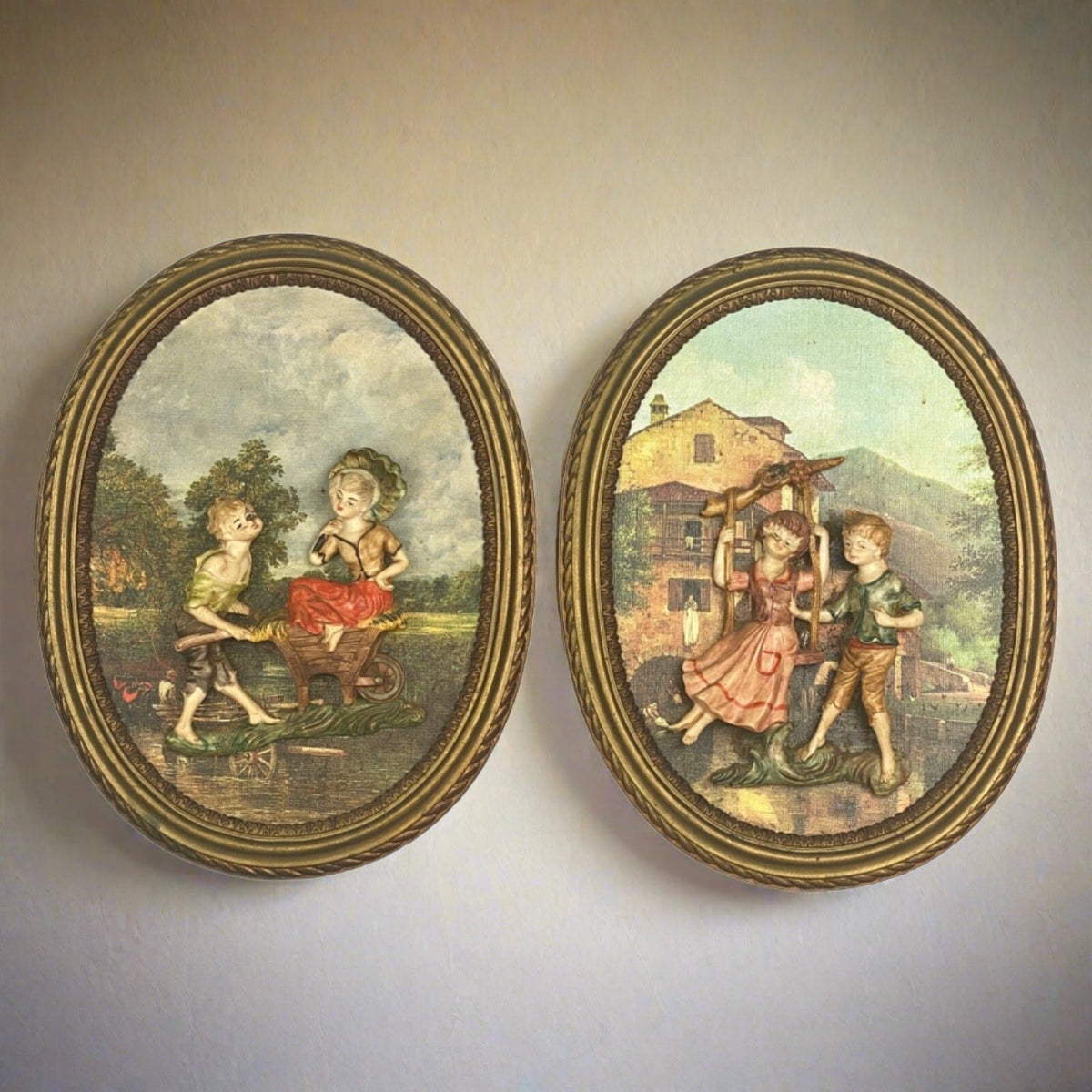 Pair of Boy and Girl Depose Italy 3D Figures Situated in an Oval Frames 16"x12"