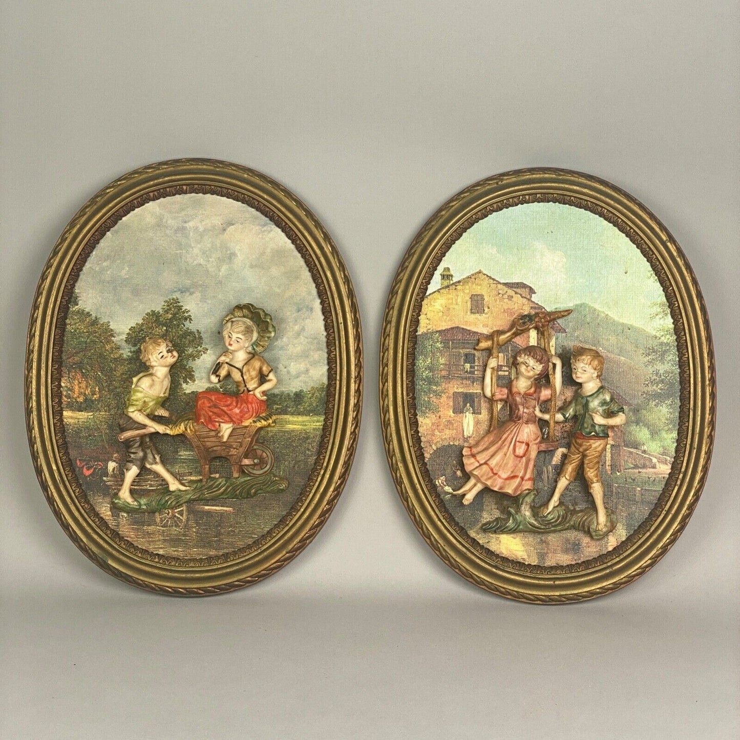 Pair of Boy and Girl Depose Italy 3D Figures Situated in an Oval Frames 16"x12"