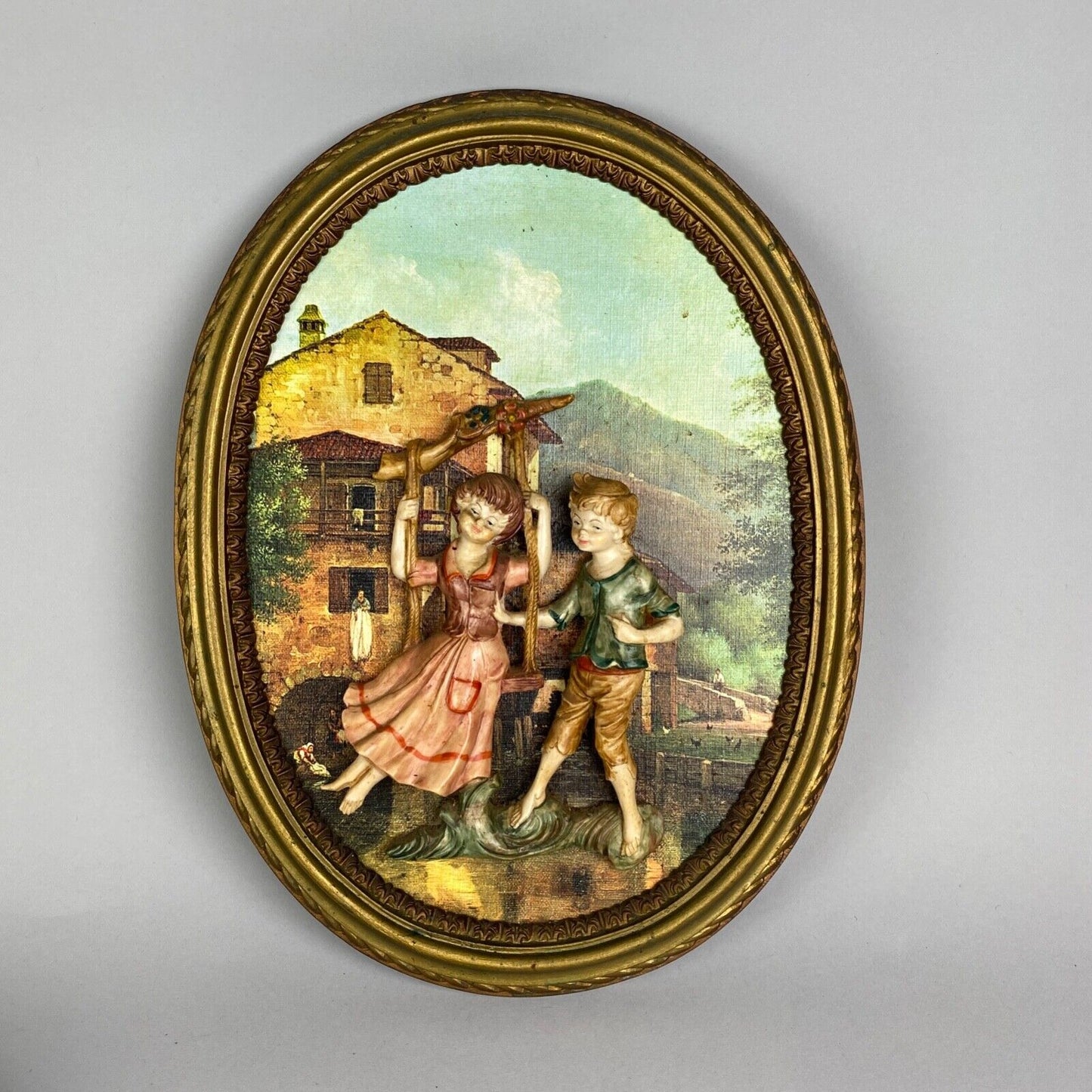 Pair of Boy and Girl Depose Italy 3D Figures Situated in an Oval Frames 16"x12"