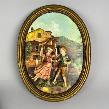 Pair of Boy and Girl Depose Italy 3D Figures Situated in an Oval Frames 16"x12"