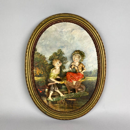 Pair of Boy and Girl Depose Italy 3D Figures Situated in an Oval Frames 16"x12"