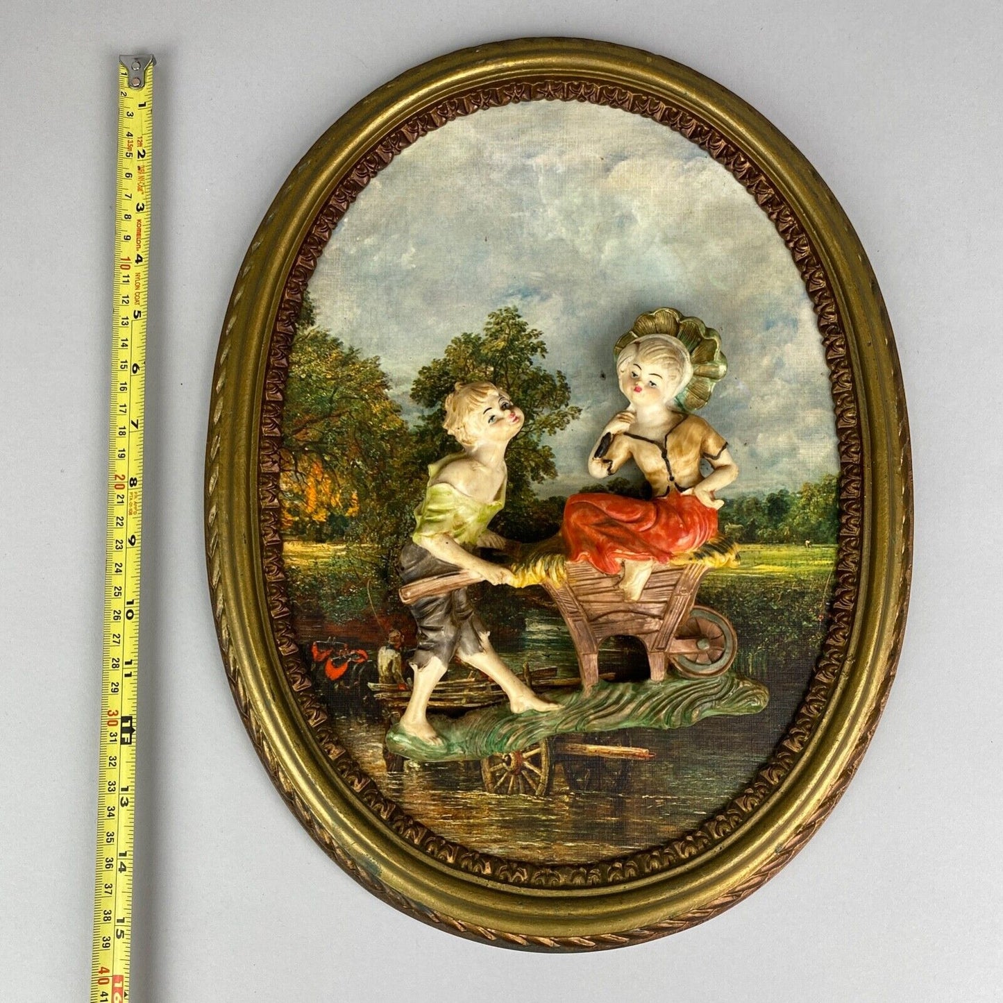 Pair of Boy and Girl Depose Italy 3D Figures Situated in an Oval Frames 16"x12"