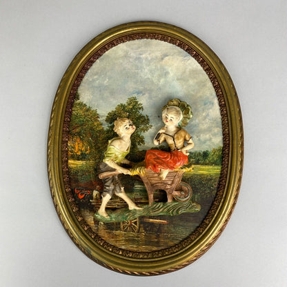 Pair of Boy and Girl Depose Italy 3D Figures Situated in an Oval Frames 16"x12"