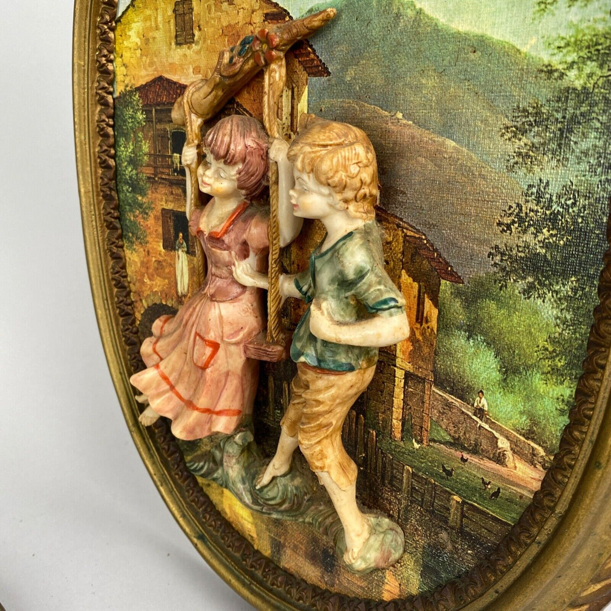 Pair of Boy and Girl Depose Italy 3D Figures Situated in an Oval Frames 16"x12"